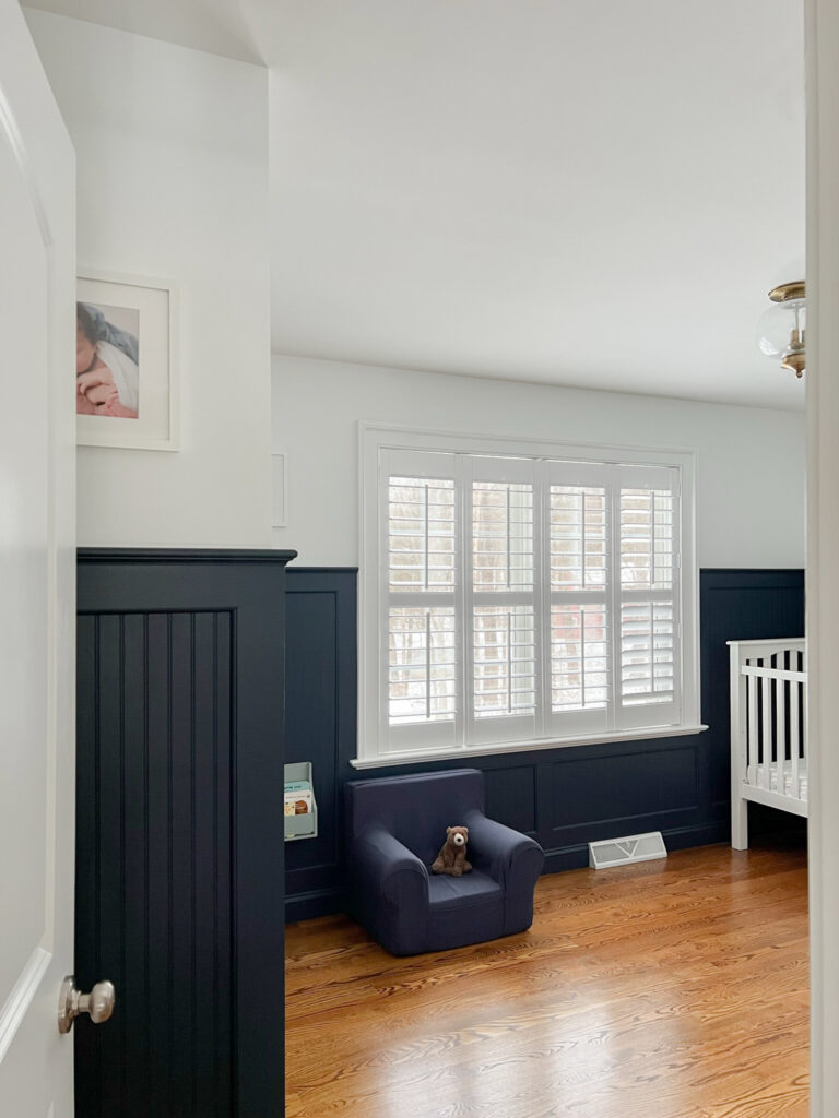 Baby's room with nautical blue wainscoting. 