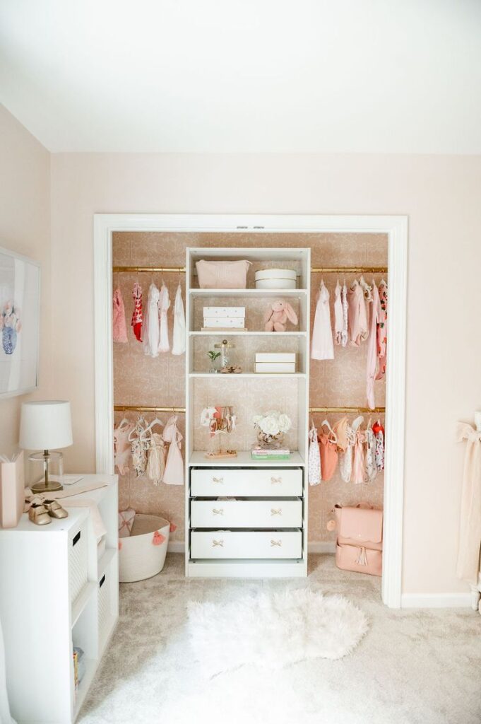 Pink bedroom with open closet using PAX IKEA unit