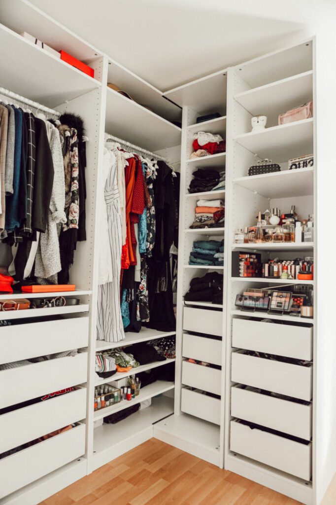 Closet with white shelves and drawers 