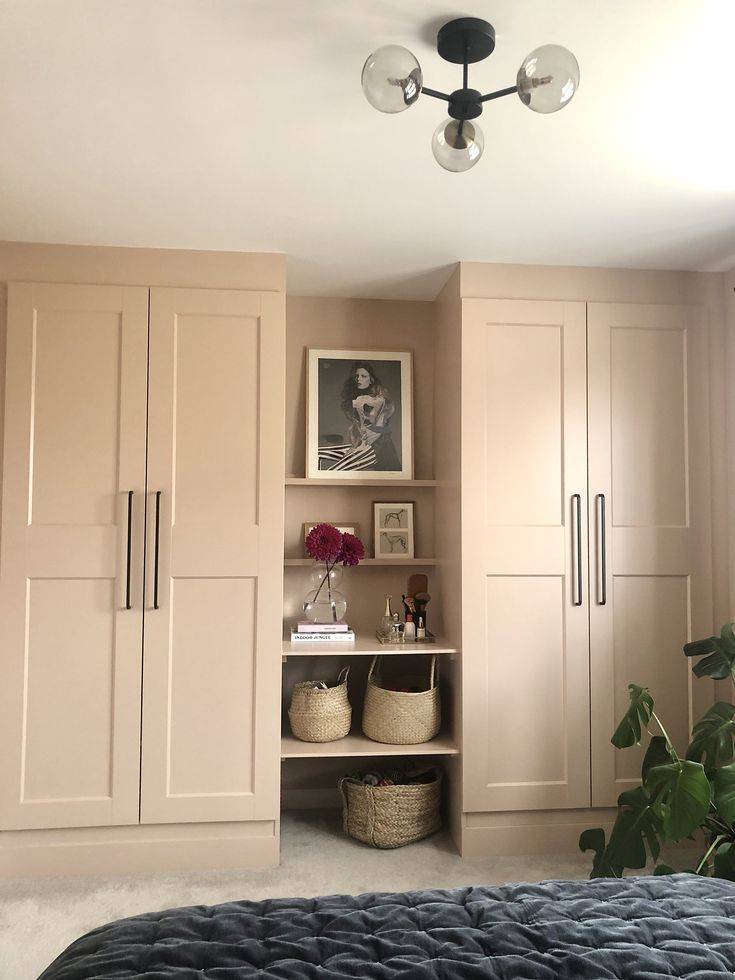 Black brass hardware on peach colored IKEA closet unit