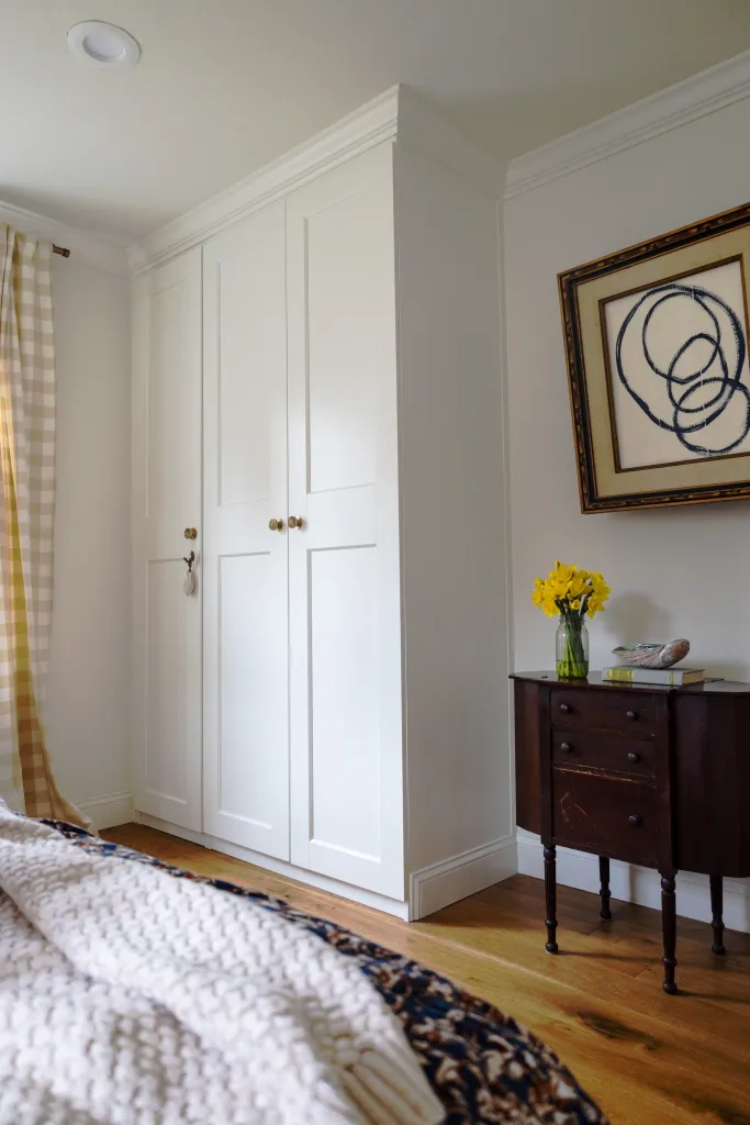 Crown molding around white wardrobe