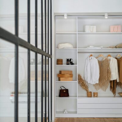 white bath towel on white wooden cabinet